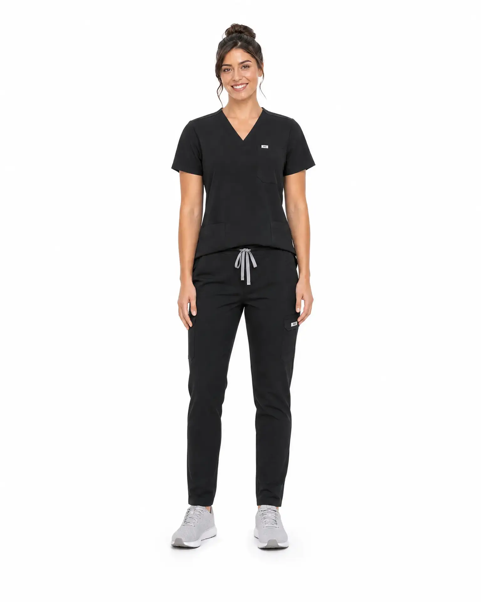 Black scrub set front view, woman wearing V-neck scrub top and jogger pants