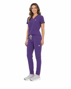 Women's purple scrubs three-quarter view, woman smiling